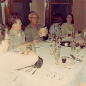 Passover 1966 at home of William J. Dumes in Vincennes.  Freda far left, then Mildred, then WJD breaking the matzo, not sure whose back of the head, then Adie Dansker Himm (1966)