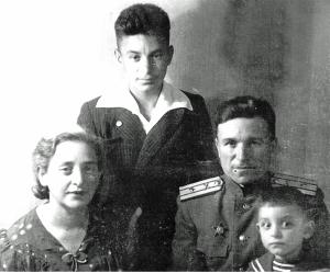 Polina, granddaughter of Genoca Dumesh, George, son of Polina, George Platonov, husband of Polina,
father of George and Victor, and Victor, son of Polina. (1945)