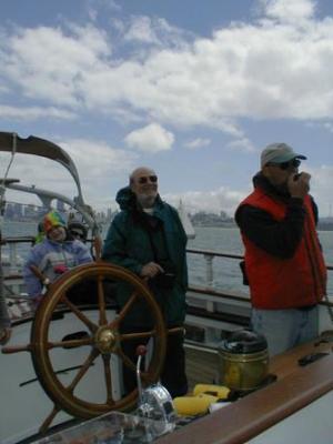 Harry at the wheel of the Irving Johnston, a square rigger. Sure is different than a tiller.
 (~2003)