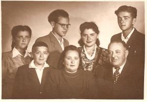 Back row, left to right: Fanya Dumesh, Aron Dumesh, son of Sora, Leika, niece of Bluma Dumesh, and Leizer Dumesh.
Front row:  Wulf Dumesh, Bluma Dumesh, and Israel Dumesh, son of Genoch
 (1949)