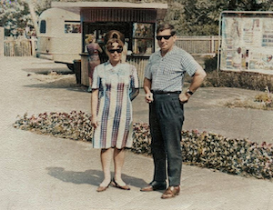 Julya standing next to a guy in Riga