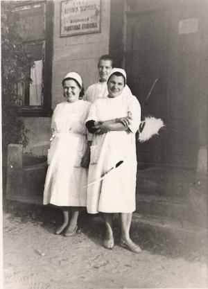 Tanya in front of the hospital.  She is on the left. (~1962)