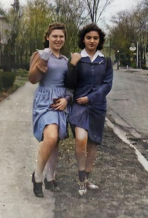 This cute one is my Aunt Mildred, on the left, my Dad's sister with cousin Ruthie Fishman, who was one of my favorite people ever. I think this is around 1940, so they would both be 16. <br><br>Ruthie told me how close she and Mildred were. She told me a story about Mildred's driving prowess. She said they were driving down to Evansville on route 41 which at that time was just a 2-lane road, meaning you were driving against oncoming traffic. <br><br>Ruthie said she was starting to panic as there was a car trying to pass another one, and they were in their lane coming toward them. She said, 'Mildred, Mildred!' a couple of times, trying to get her attention, but Mildred was telling a story and wasn't going to be interrupted. <br><br>Finally, and it seemed to Ruthie as if it were at the final moment, Mildred veered onto the shoulder of the road, drove around the car and back onto the road after they passed, and Mildred never stopped talking the entire time. 