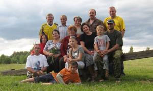 Picnic, final day in Daugavpils.  Back row, L to R: Bruce, Misha's dad, Tanya, Sasha, Misha. next row: Marina, Julia, Misha's mom, Elena, Max, Sergey. Next: Leonid, Nastya.  Ilya lying on the ground (2009)