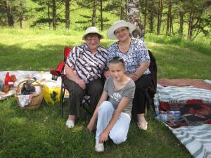 Misha's mom and Julia with Nastya in front (2009)