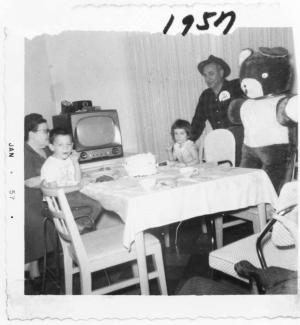 Freda, Harold and Sandi Dumes with Morey Friedman (family friend) and huge bear (no relation to Norma, Leon, Alice or David Bear) (1957)