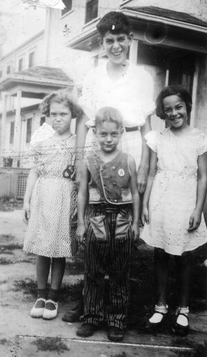 I think it's Stan Shapiro in back and in front from left to right, Mildred Dumes, Stan Dumes, Millie Shapiro Lerman (~1931)