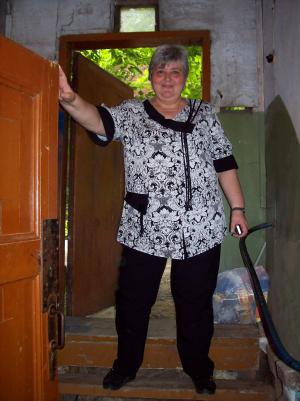 Olga Dumesh Mikheev in the doorway to Moisey Dumesh's  apartment, which was in the basement of the house. (2008)