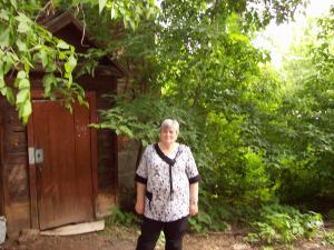 Olga Dumesh Mikheev in front of the door of   Moisey's apartment. (2008)