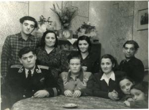 From left to right: Leiser Dumesh, Israel Dumes (son of Moisey), Bluma Dumesh, Elena Dumesh, Feiga, Bluma's sister Ida, and then Ida's children. Ida's husband Velvel sits behind them. (1954)