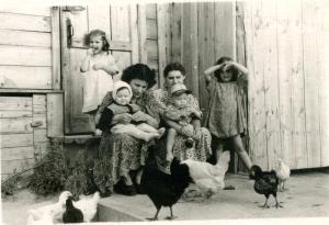 From left to right: Olga Dumesh Mikheev, Berta Shapiro Khitrin holding ,Svetlana Khitrin [Gutkin], Lilia Dumesh holding Eugene Bort, Eugenia Dumesh (Valder).     (1956)