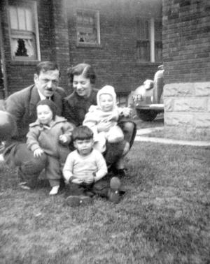 Uncle Phil Fialco with unknown woman.  Uncle Phil is holding Mark Fialco and it's Marvin Fialco in front.  The baby being held by the lady is also unknown.


 (~1940)