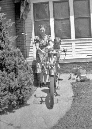 woman and child in front of second street house, i think 